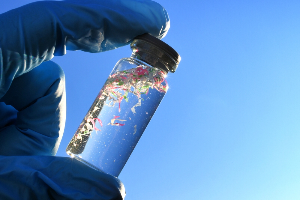 Vial of water containing microplastics